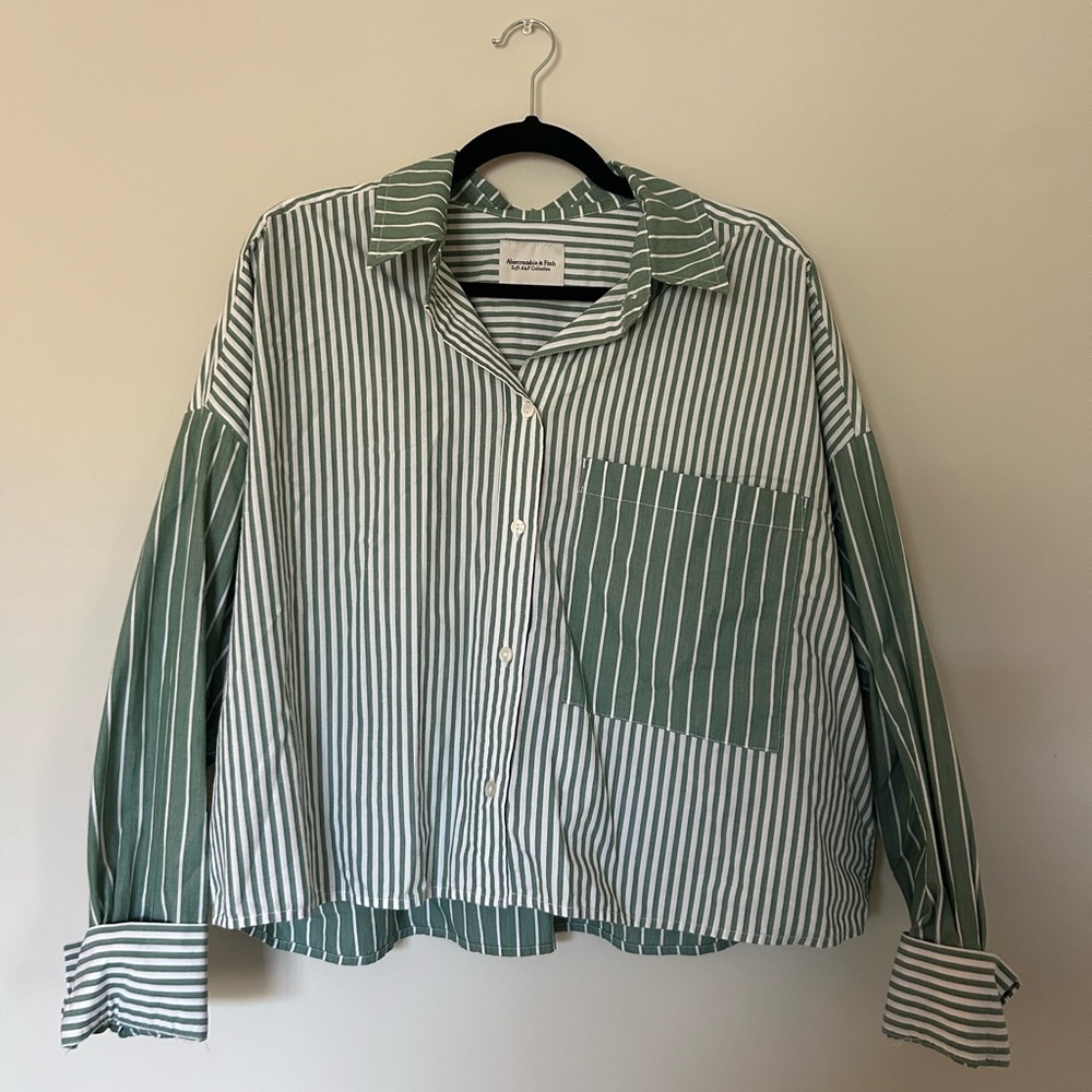 Green striped button down long sleeve top.